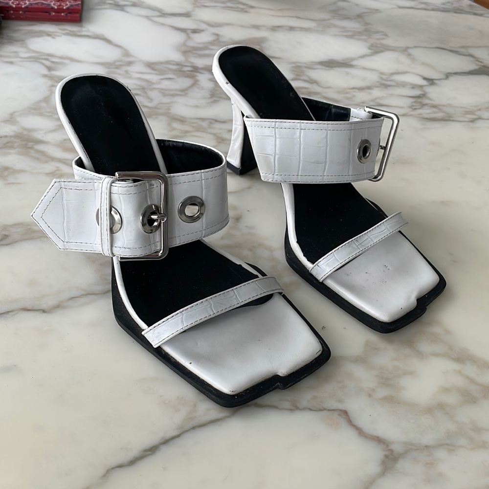 White Buckle sandals. Size 7. Good condition. Great slip on with jeans or dress.